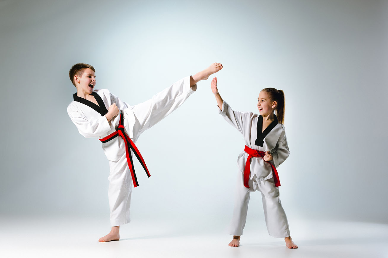 The studio shot of group of kids training karate martial arts